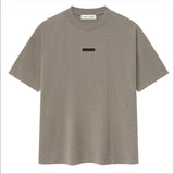Polera Fear of God Essentials Classic Logo Metálico FW25 - Gris Taupe